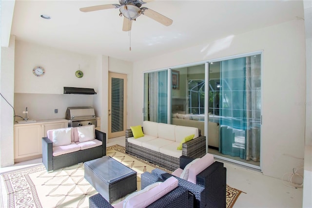 living room featuring sink and ceiling fan