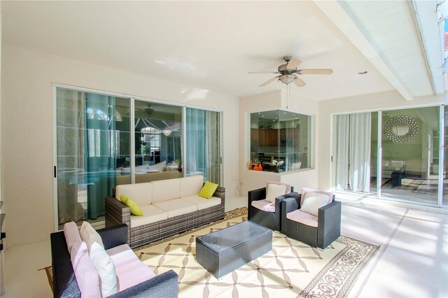 exterior space featuring an outdoor hangout area and ceiling fan