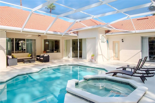 view of swimming pool with a patio area, an outdoor hangout area, and an in ground hot tub