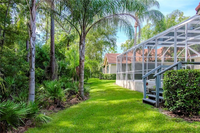 view of yard with a lanai