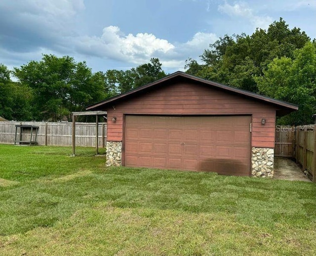 garage with a lawn