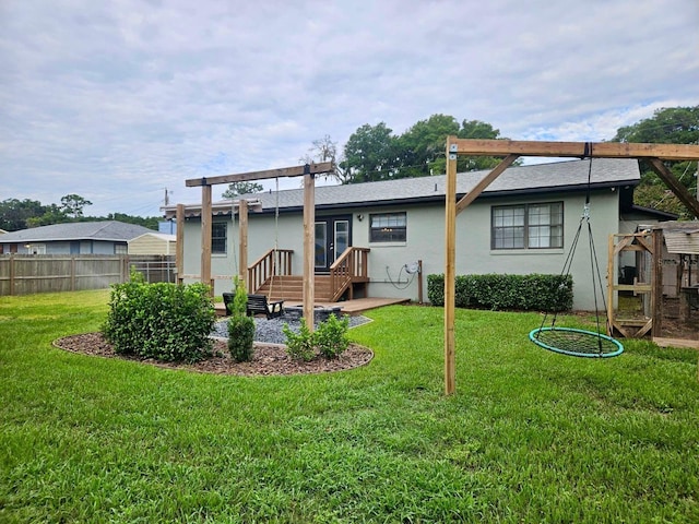 rear view of house with a yard