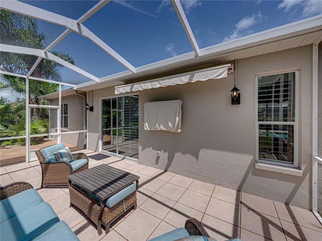 view of patio with outdoor lounge area and a lanai