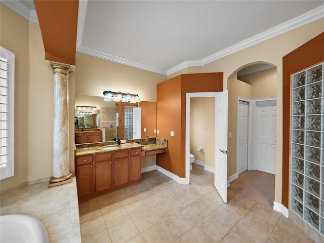 bathroom featuring decorative columns, toilet, a shower, vanity, and ornamental molding