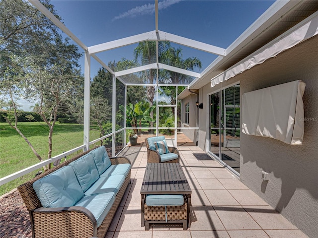 view of patio / terrace with an outdoor hangout area and glass enclosure