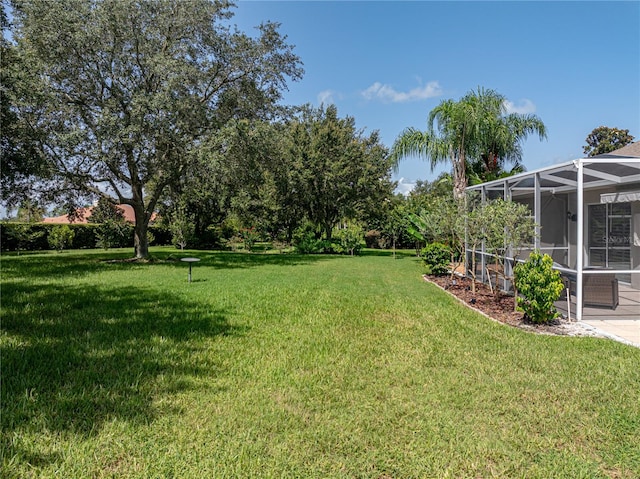 view of yard with a lanai