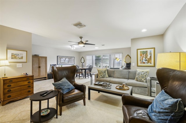 living room featuring a ceiling fan, recessed lighting, visible vents, and light tile patterned floors