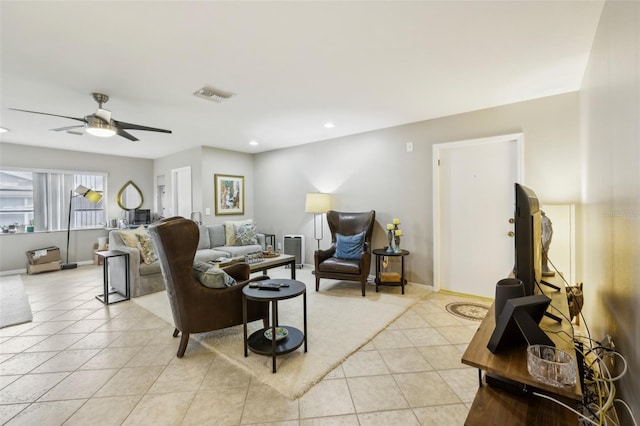 living area with a ceiling fan, recessed lighting, visible vents, and light tile patterned flooring