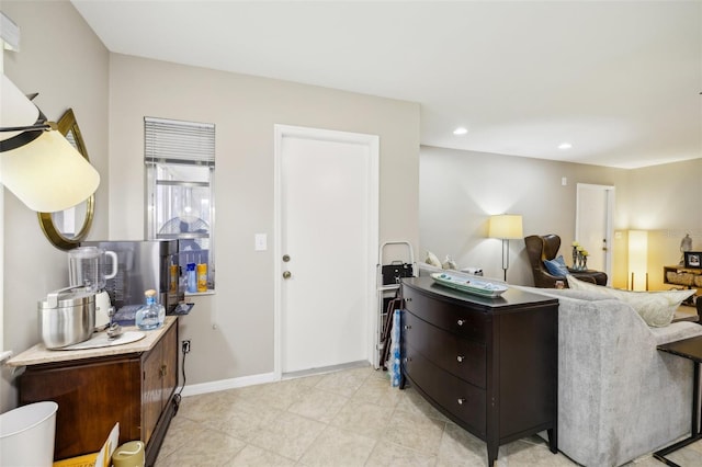 living room with recessed lighting and baseboards