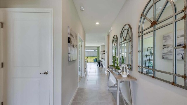 hallway featuring light tile patterned flooring