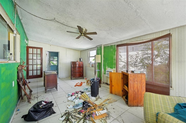 miscellaneous room featuring ceiling fan and a textured ceiling