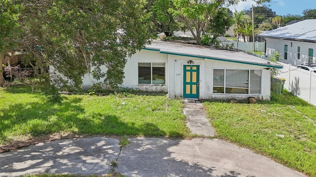 view of front of house with a front lawn