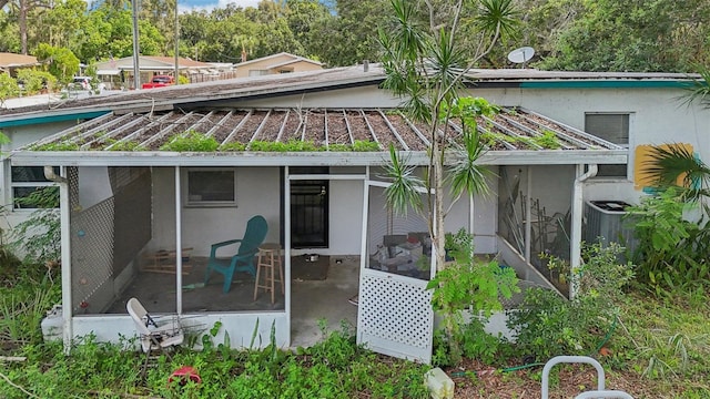 rear view of house with a sunroom