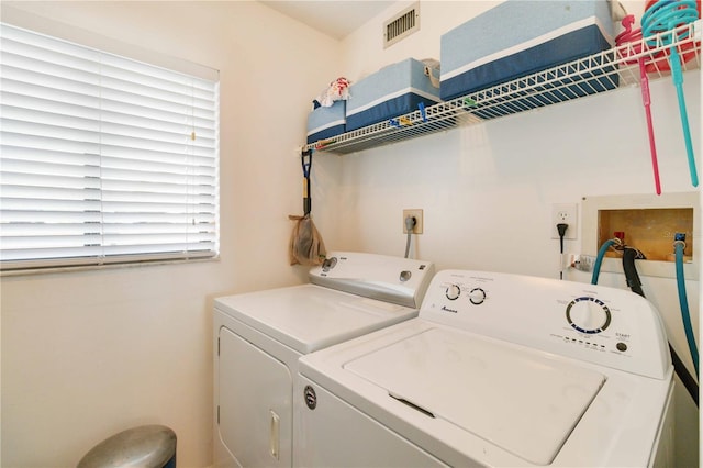 laundry area featuring independent washer and dryer