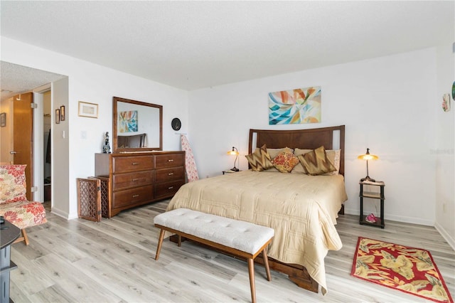 bedroom with light hardwood / wood-style flooring