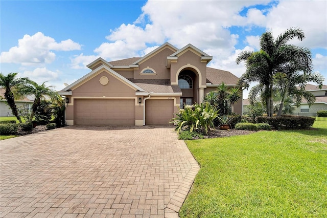 view of front facade featuring a garage and a front lawn