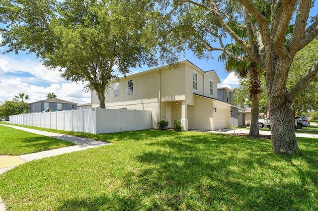 view of side of property with a lawn