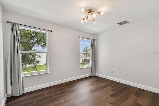 unfurnished room featuring dark wood-type flooring