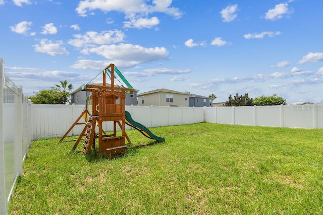 view of jungle gym featuring a lawn