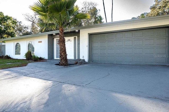 ranch-style home featuring a garage