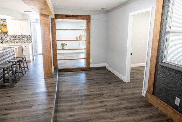 hallway featuring dark hardwood / wood-style floors