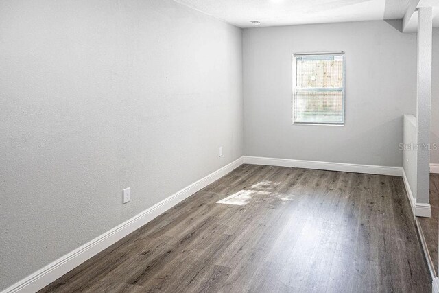 unfurnished room featuring hardwood / wood-style floors