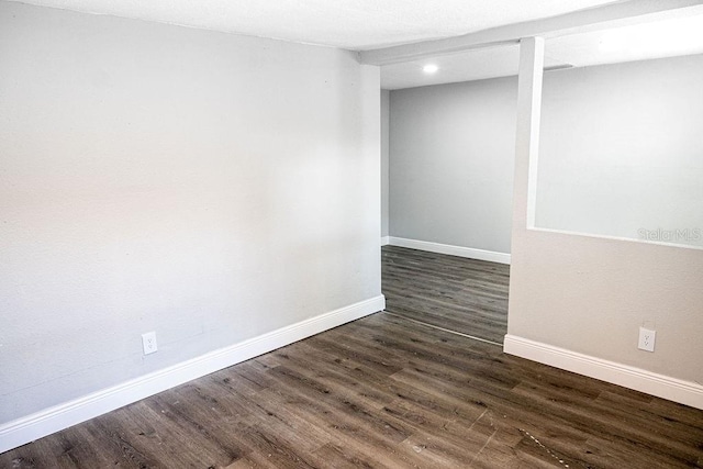 basement with hardwood / wood-style floors