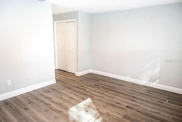 spare room featuring hardwood / wood-style floors