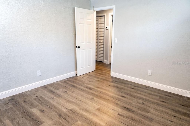 spare room featuring hardwood / wood-style floors