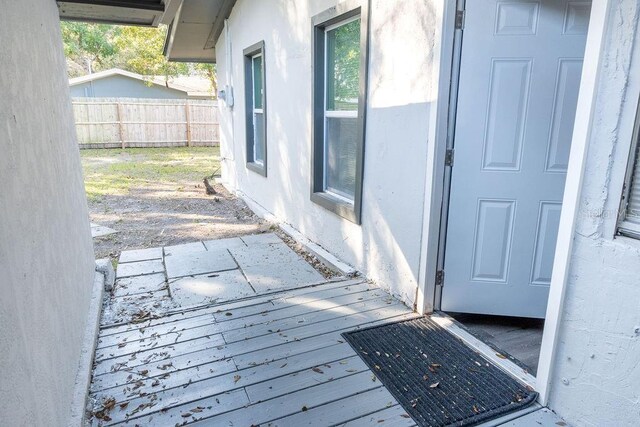 entrance to property with a deck