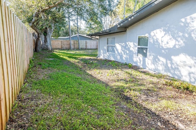 view of yard with a fenced backyard