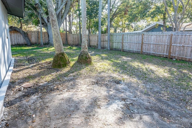 view of yard with a fenced backyard