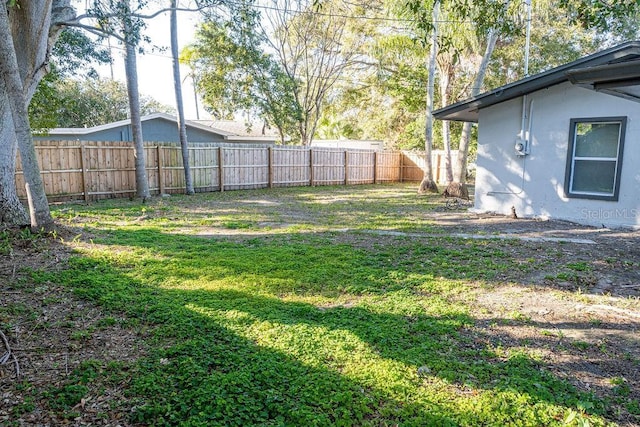 view of yard featuring a fenced backyard