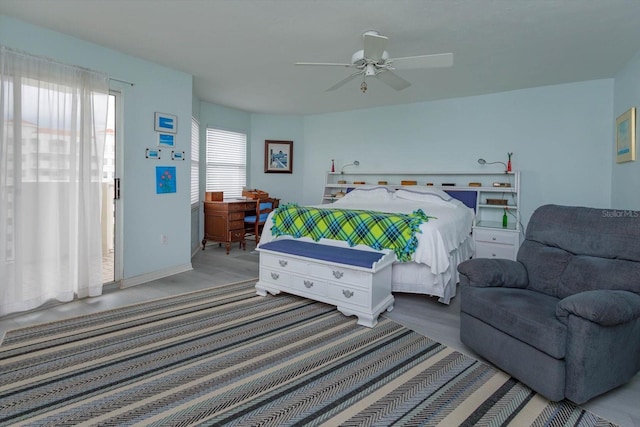 bedroom featuring hardwood / wood-style floors and ceiling fan