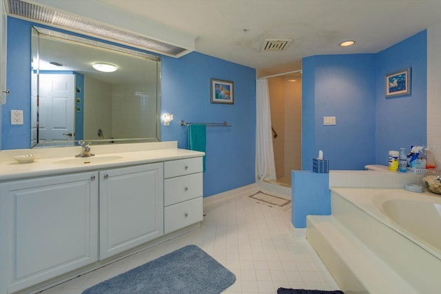 bathroom featuring tile patterned floors, plus walk in shower, and vanity