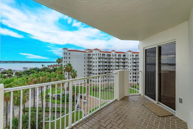 balcony featuring a water view