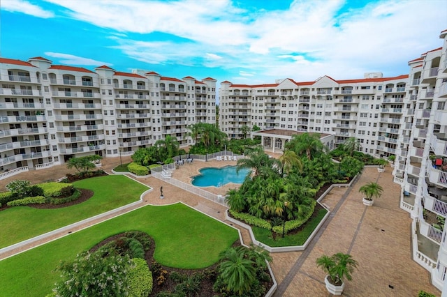 view of building exterior with a community pool