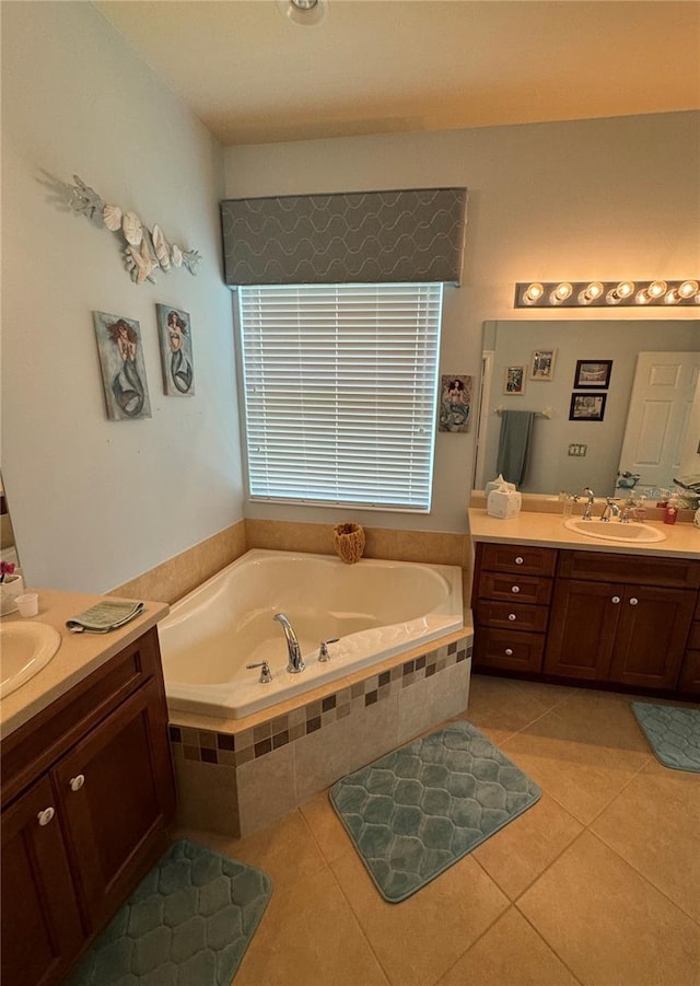 bathroom featuring vanity, tiled bath, and tile patterned floors