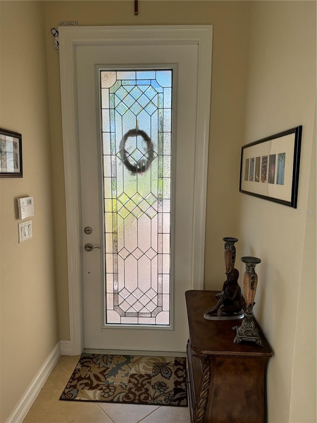 foyer entrance featuring light tile patterned floors