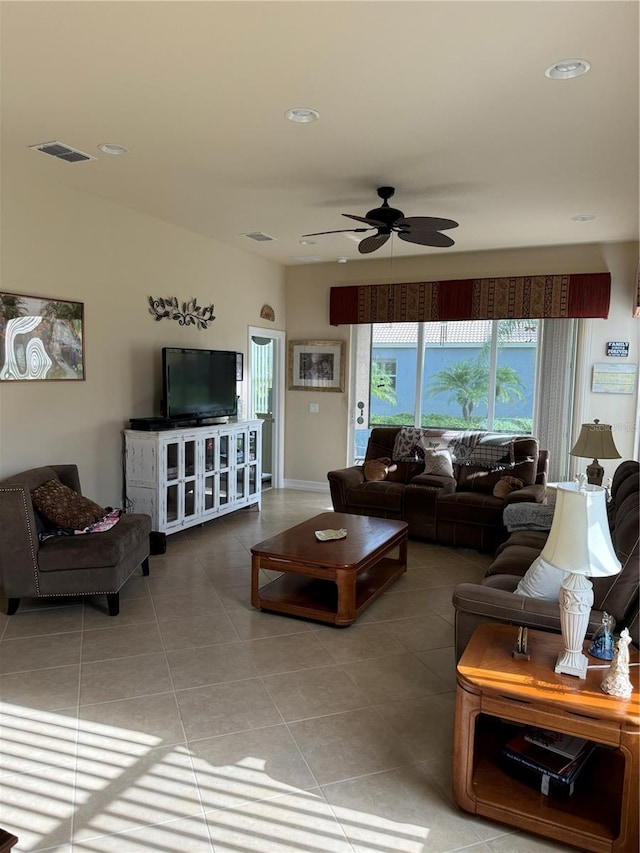 living room with tile patterned floors and ceiling fan