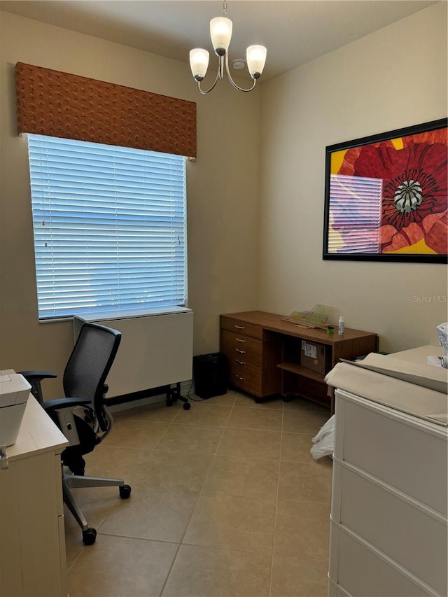 tiled office with a notable chandelier