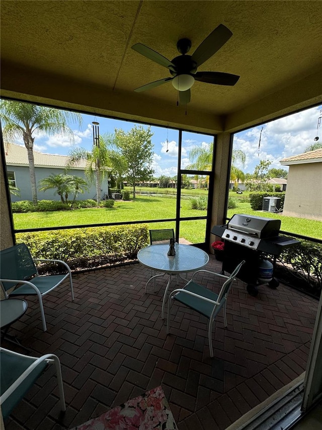 sunroom / solarium with ceiling fan