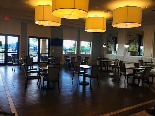 dining area with dark wood-style floors and visible vents