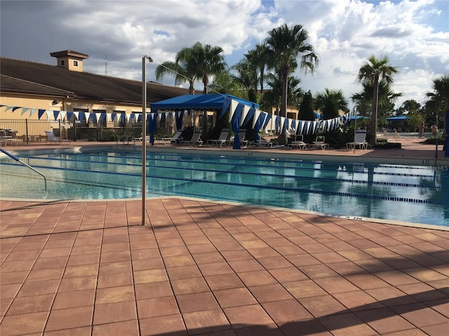 community pool featuring fence