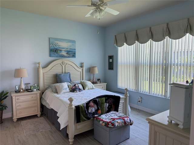 15953 Cobble Mill Dr, Wimauma, FL 33598 - bedroom with baseboards, light wood-style flooring, and ceiling fan