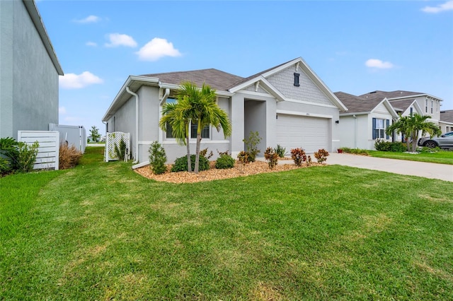 view of front of property with a garage and a front lawn