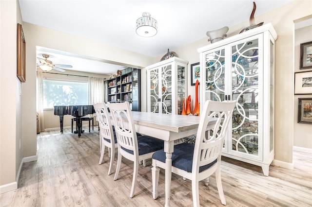 dining room featuring light wood-type flooring and ceiling fan