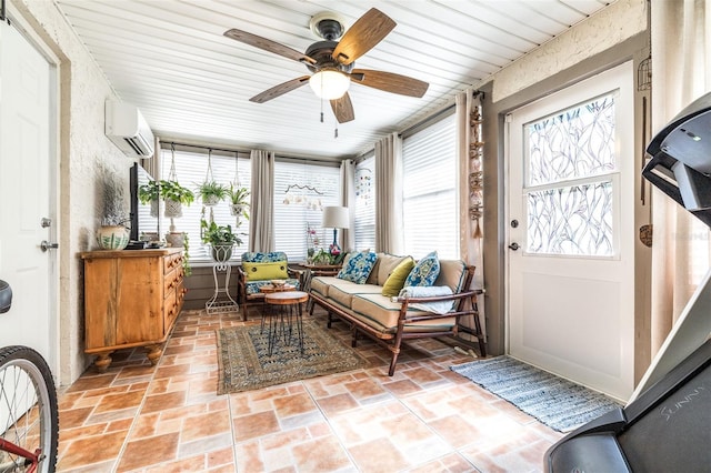 sunroom featuring a wall mounted air conditioner and ceiling fan