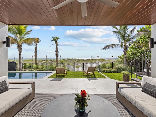 view of patio featuring an outdoor living space, a fenced in pool, and ceiling fan