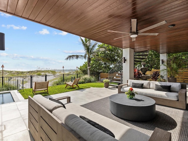 view of patio with ceiling fan and an outdoor living space